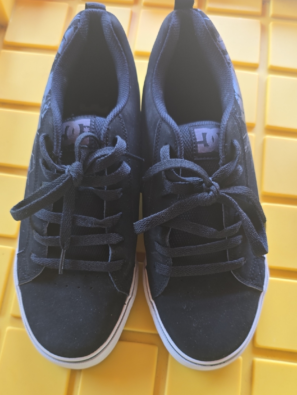 DC black shoe interior with white label